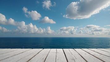 White wooden table with blue sky and sea background for product display. . photo