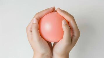 Close-up of hands holding a stress ball photo