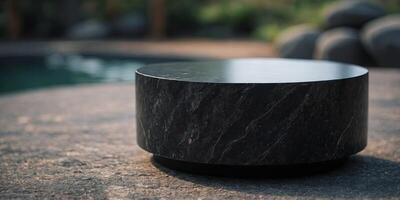 black podium for display product material from black stone can be use for presentation jewelry, watch, cosmetic. photo
