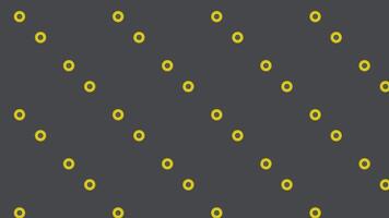 Seamless loop animation of yellow circles dividing into two smaller circles, then merging back into one, against dark grey background, Ideal for science, technology, or abstract background video