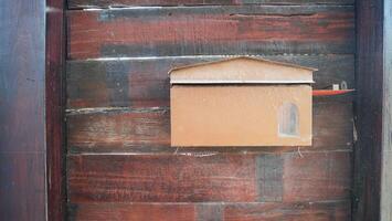 vintage mailbox on wood plank background photo