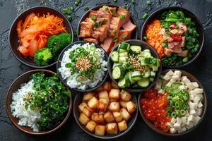 An assortment of colorful bowls filled with rice vegetables and meat arranged on a black surface photo