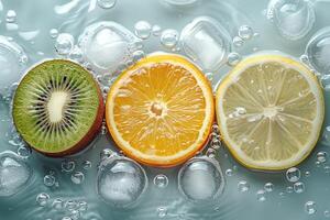 Colorful citrus slices and kiwi floating in water with bubbles photo