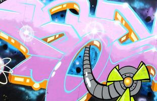 Colorful background of graffiti painting artwork with bright aerosol outlines on wall. Old school street art piece made with aerosol spray paint cans. Contemporary youth culture photo