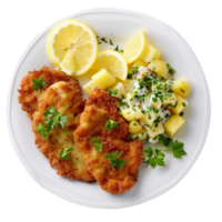 German schnitzel with lemon slices and parsley, accompanied by potato salad on a transparent background png