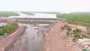 Aerial view of a large dam with spillways video