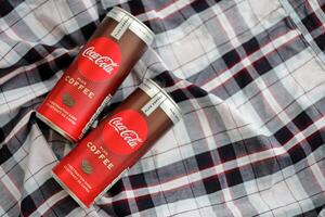 KYIV, UKRAINE - OCTOBER 31, 2023 Can of Coca Cola with coffee flavor. Closed tin can of drink with special design photo
