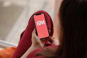 KYIV, UKRAINE - FEBRUARY 23, 2024 Senior Match logo of famous dating website or app on iPhone display photo