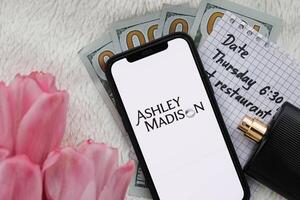 KYIV, UKRAINE - FEBRUARY 23, 2024 Ashley Madison logo of famous dating website or app on iPhone display photo