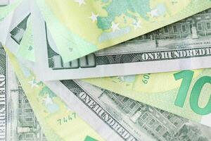 KYIV, UKRAINE - FEBRUARY 28, 2024 US Dollar and EU Euro money bills in fan layout. Different popular currencies photo