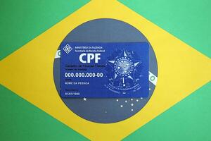 KYIV, UKRAINE - OCTOBER 31, 2023 Blue CPF card document template. The document guarantees authenticity and integrity in electronic communication between people in Brazil photo