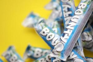 KYIV, UKRAINE - OCTOBER 31, 2023 Bounty chocolate bars with cocoa flavor filling. Bounty chocolate bar is a brand of American Mars Inc photo