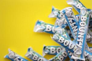 KYIV, UKRAINE - OCTOBER 31, 2023 Bounty chocolate bars with cocoa flavor filling. Bounty chocolate bar is a brand of American Mars Inc photo