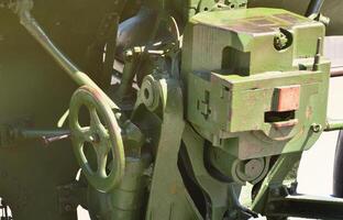 A close-up mechanism of a portable weapon of the Soviet Union of World War II, painted in a dark green color photo