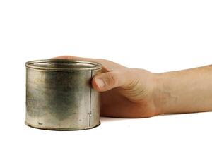 Old tin can in hand photo