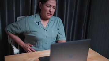 Serious woman worked so hard that her stomach hurt, after working on a laptop computer at home, for a long time, period pain, Poor health, The work was not completed as scheduled, Tired and wo video