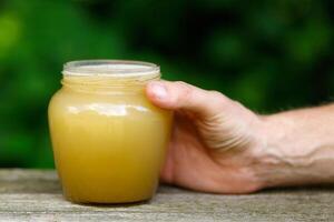 Honey in a jar on the pass. photo