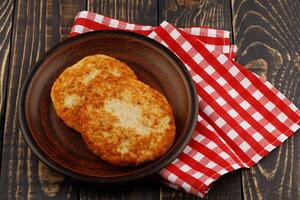 Fish cutlets on a plate photo