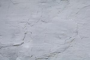 Clay surface. The clay wall is whitewashed with lime photo