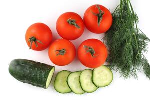 Tomatoes and cucumbers isolate top view photo
