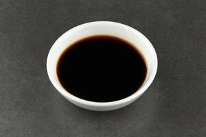 soy sauce bowl on a concrete background photo