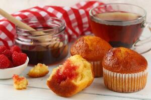 Breakfast with muffins. Delicious pastries on the table photo