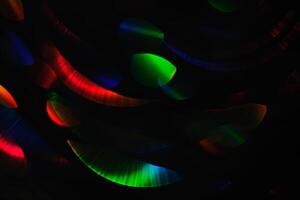Abstract black background with bokeh of different colors. photo