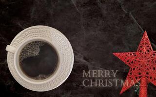 coffee with white cup with dark background written 2023, happy new year 2023, with message from merry christmas photo
