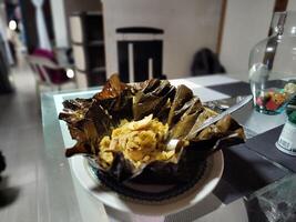 Typical Colombian food on the table, tamale from Tolima photo