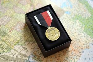 KYIV, UKRAINE - JULY 10, 2024 US Army of Occupation medal. United States military award medal with ribbon and pin. Handmade paper theater props photo