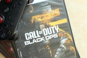 KYIV, UKRAINE - JUNE 26, 2024 Call of Duty Black Ops 6 PS5 game disc box for console gaming. Popular game disc photo