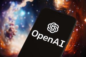 KYIV, UKRAINE - MARCH 17, 2024 OpenAI logo on iPhone display screen with background of artificial intelligence futuristic image photo