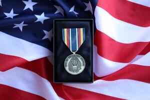KYIV, UKRAINE - JULY 10, 2024 Global War on Terrorism Service medal. United States military award medal with ribbon and pin. Handmade paper theater props photo