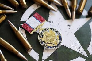 KYIV, UKRAINE - JULY 10, 2024 Distinguished Service medal. United States military award medal with ribbon and pin. Handmade paper theater props photo