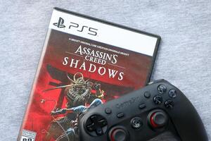 KYIV, UKRAINE - JUNE 26, 2024 Assassin's Creed Shadows PS5 game disc box for console gaming. Popular game disc photo