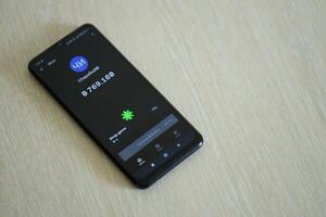 KYIV, UKRAINE - APRIL 20, 2024 Blum telegram bot on smartphone screen. Blum is a viral Telegram based crypto game for earn tokens by managing virtual crypto exchange photo