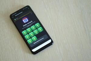 KYIV, UKRAINE - APRIL 20, 2024 Hamster Kombat telegram bot on smartphone screen. Hamster Kombat is a viral Telegram crypto game for earn HMSTR tokens by managing virtual crypto exchange photo