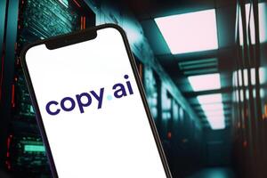 KYIV, UKRAINE - MARCH 17, 2024 CopyAI logo on iPhone display screen with background of artificial intelligence futuristic image photo