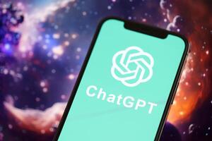 KYIV, UKRAINE - MARCH 17, 2024 ChatGPT logo on iPhone display screen with background of artificial intelligence futuristic image photo