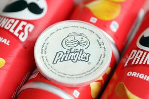 KYIV, UKRAINE - FEBRUARY 27, 2024 Pringles original potato chips on white background photo