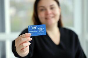 KYIV, UKRAINE - OCTOBER 31, 2023 Blue CPF card document template. The document guarantees authenticity and integrity in electronic communication between people in Brazil photo