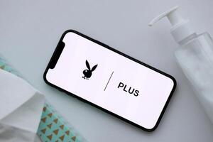 KYIV, UKRAINE - JANUARY 23, 2024 PlayboyPlus adult content website logo on display of iPhone 12 Pro photo