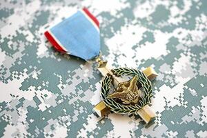 KYIV, UKRAINE - JULY 10, 2024 US Air Force Cross medal. United States military award medal with ribbon and pin. Handmade paper theater props photo
