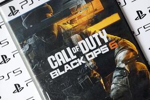 KYIV, UKRAINE - JUNE 26, 2024 Call of Duty Black Ops 6 PS5 game disc box for console gaming. Popular game disc photo