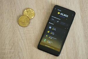 KYIV, UKRAINE - APRIL 20, 2024 Notcoin telegram bot on smartphone screen. Notcoin is a viral Telegram based crypto game for earn tokens by managing virtual crypto exchange photo