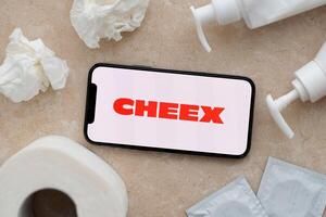 KYIV, UKRAINE - JANUARY 23, 2024 Cheex adult content website logo on display of iPhone 12 Pro photo