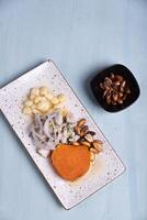 View from above of a representative dish of Peruvian gastronomy with a portion of roasted corn. photo