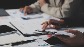Team of business people working together in the meeting room office, teamwork background charts and graphs banner, double exposure successful teamwork,business planning concept. video