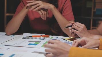 Team of business people working together in the meeting room office, teamwork background charts and graphs banner, double exposure successful teamwork,business planning concept. video