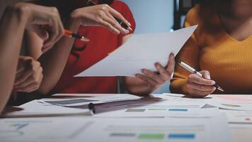 Team of business people working together in the meeting room office, teamwork background charts and graphs banner, double exposure successful teamwork,business planning concept. video